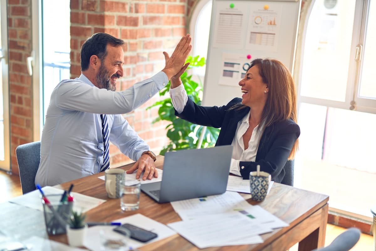 An agency team collaborating in Business Management AI